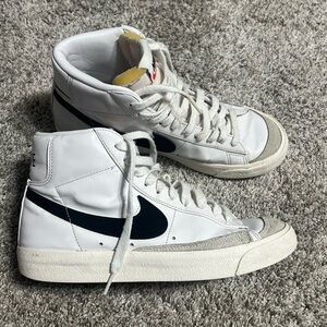 Women’s Nike White High-Top Sneakers with Black Swoosh
